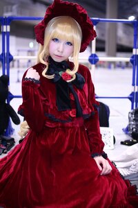 Rating: Safe Score: 0 Tags: 1girl blonde_hair blue_eyes blurry blurry_background bonnet depth_of_field dress flower frills long_sleeves looking_at_viewer photo red_dress rose shinku solo User: admin