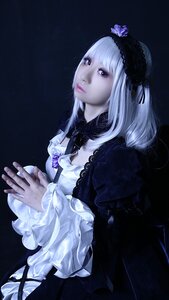 Rating: Safe Score: 0 Tags: 1girl black_ribbon closed_mouth dress flower frilled_sleeves frills gothic_lolita hairband lips lolita_fashion long_hair long_sleeves realistic ribbon rose silver_hair solo suigintou User: admin