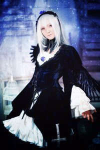 Rating: Safe Score: 0 Tags: 1girl black_dress black_wings blurry dress feathers flower frills gothic_lolita hairband lolita_fashion long_hair long_sleeves looking_at_viewer silver_hair solo suigintou wings User: admin