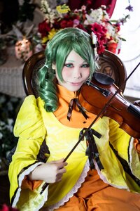 Rating: Safe Score: 0 Tags: 1girl blurry blurry_background blurry_foreground depth_of_field dress drill_hair flower frills green_eyes green_hair guitar hatsune_miku instrument kanaria music playing_instrument smile solo violin yellow_dress User: admin