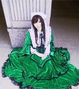 Rating: Safe Score: 0 Tags: 1girl brown_hair dress frills green_dress long_hair looking_at_viewer sitting solo suiseiseki User: admin