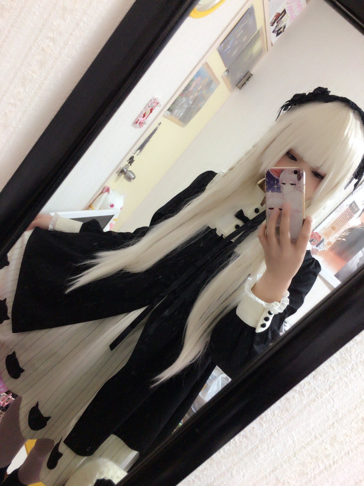 1girl bangs black_dress blonde_hair dress indoors long_hair long_sleeves mirror photo solo standing suigintou