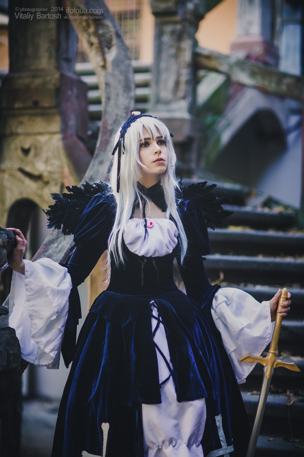 1girl blurry blurry_background blurry_foreground depth_of_field dress lips long_hair long_sleeves photo solo standing suigintou sword weapon