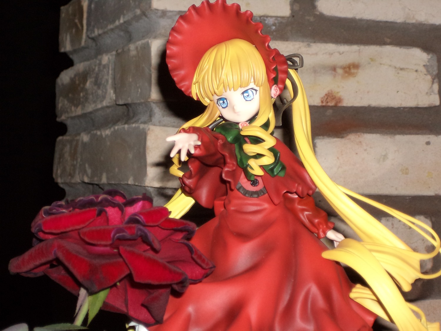 1girl bangs blonde_hair blue_eyes bonnet bow bowtie capelet doll dress frills long_hair long_sleeves looking_at_viewer red_dress shinku solo standing twintails very_long_hair