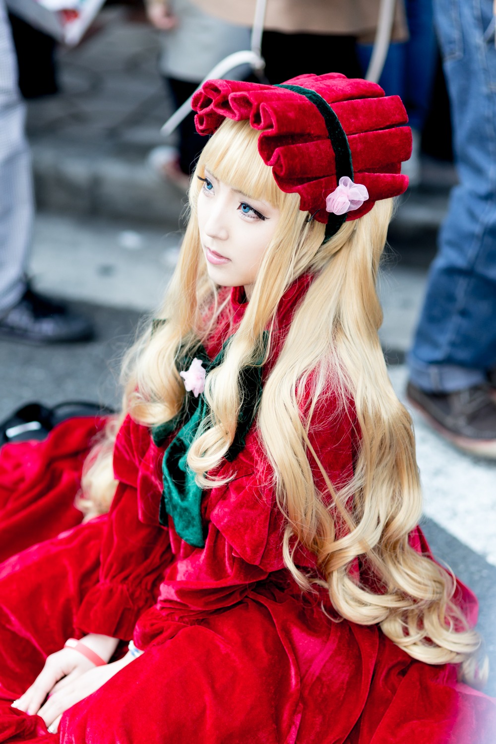 blonde_hair blue_eyes blurry blurry_background blurry_foreground depth_of_field dress hat long_hair multiple_girls photo red_dress shinku sitting solo solo_focus