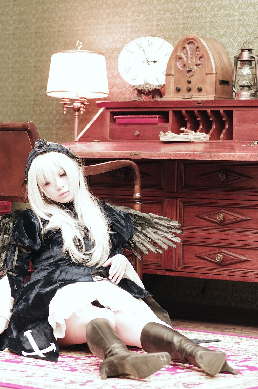 1girl boots dress long_hair sitting solo suigintou white_hair