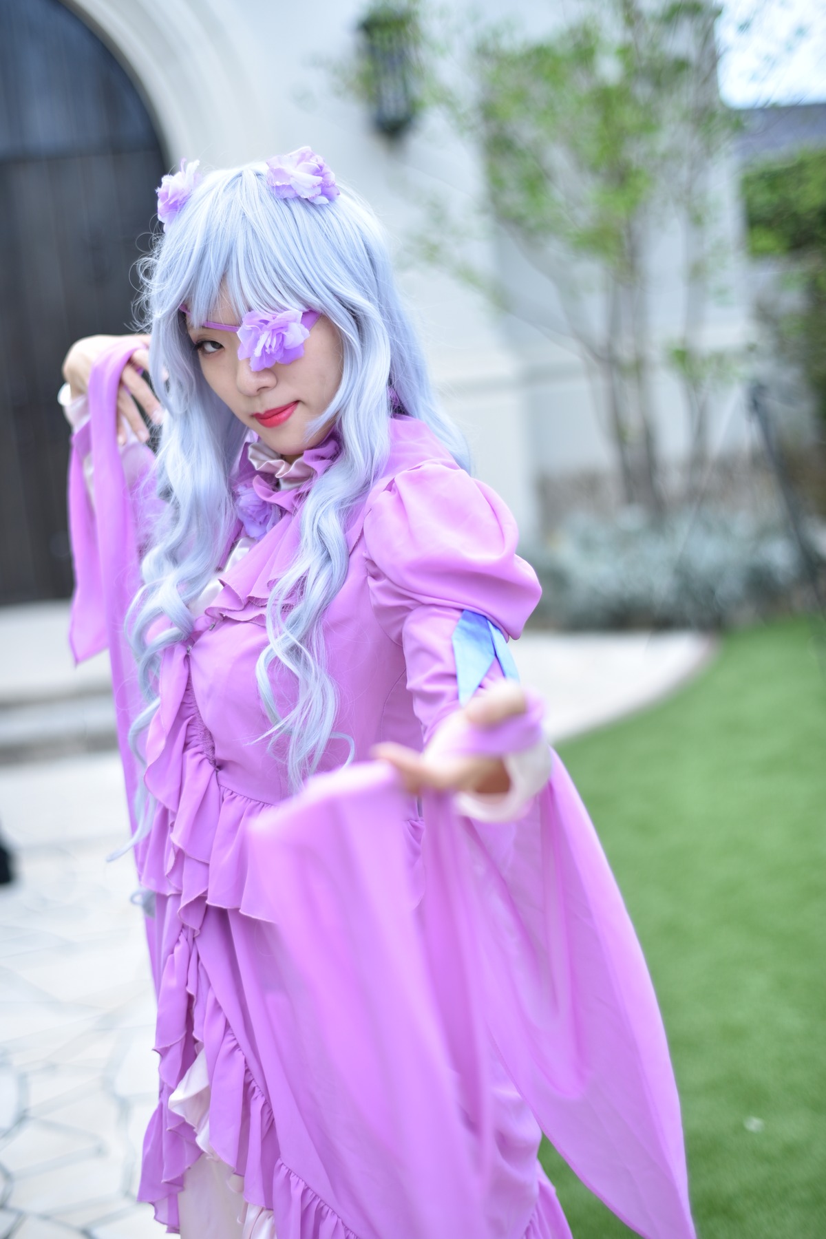 1girl barasuishou blurry blurry_background blurry_foreground depth_of_field dress eyepatch flower hair_ornament lips long_hair long_sleeves outdoors purple_hair solo