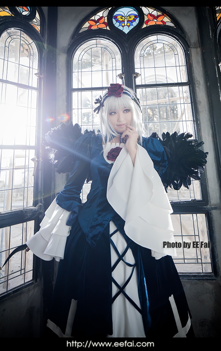 1girl blue_eyes feathers flower hair_ornament indoors long_hair looking_at_viewer solo suigintou white_hair window