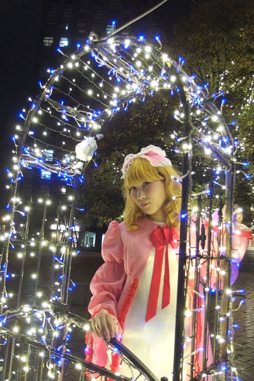 1girl blonde_hair christmas christmas_tree dress hat hinaichigo long_hair ribbon snowing solo standing