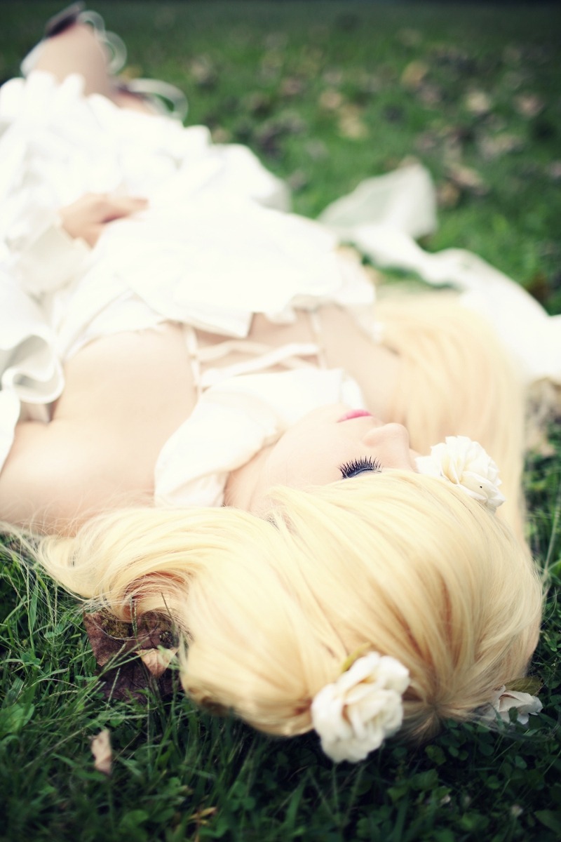 1girl bandages blonde_hair blurry blurry_background blurry_foreground depth_of_field dress flower grass hair_ornament kirakishou solo white_dress white_flower white_rose