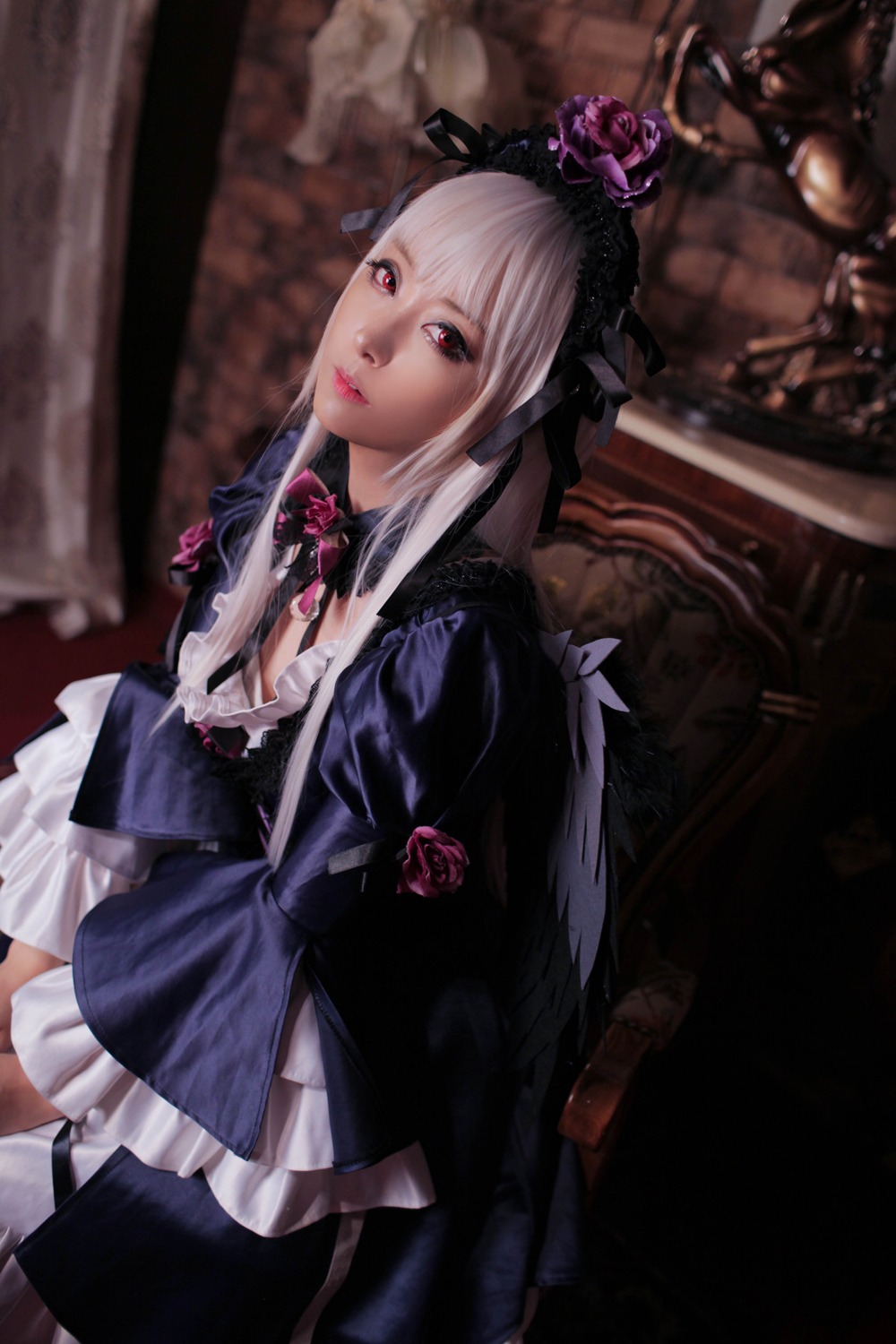 1girl blurry breasts dress flower frills gothic_lolita indoors lips lolita_fashion long_hair looking_at_viewer red_eyes solo suigintou