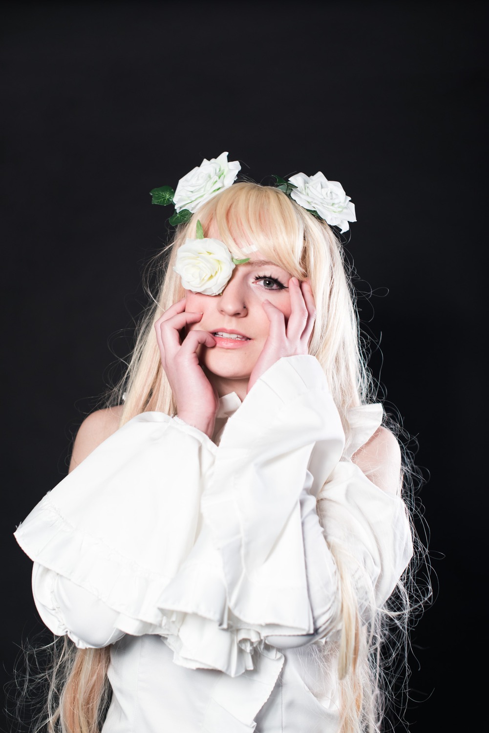 1girl bangs black_background blonde_hair dress eyepatch flower hair_flower hair_ornament hands_on_own_cheeks hands_on_own_face kirakishou lips long_hair long_sleeves looking_at_viewer one_eye_covered parted_lips rose smile solo upper_body white_dress white_flower white_rose white_sweater