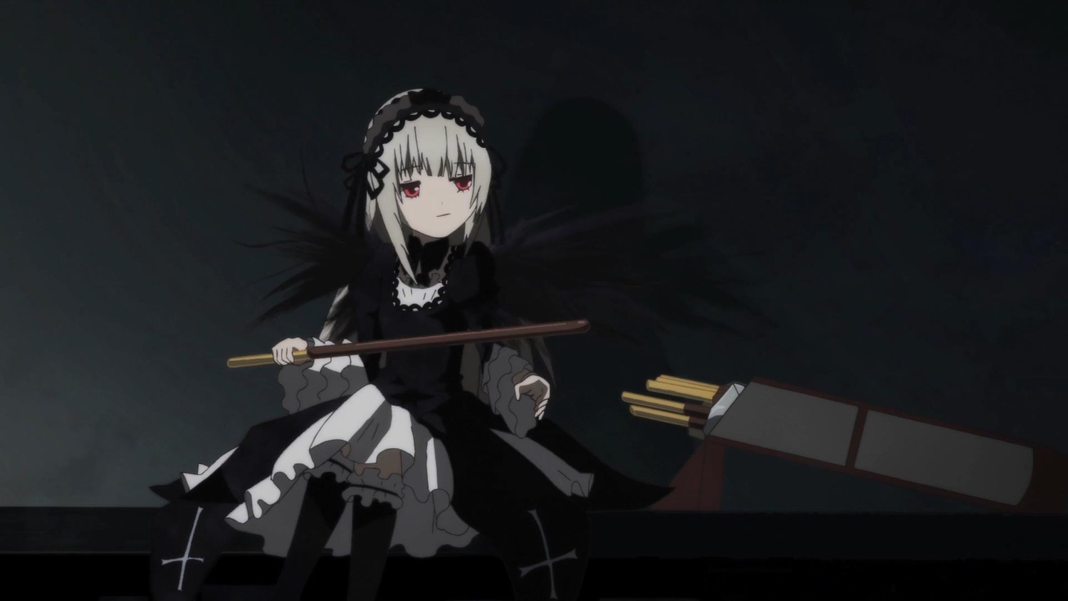 1girl black_background black_dress black_legwear closed_mouth cross dress frills hairband holding image long_sleeves looking_at_viewer red_eyes sitting solo suigintou weapon