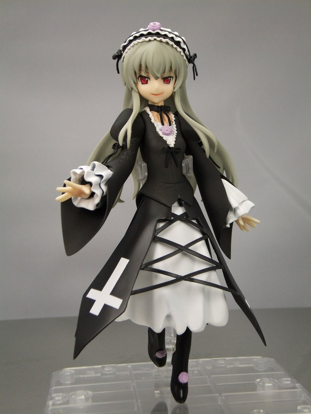 1girl black_dress doll dress frilled_sleeves frills full_body hairband long_hair long_sleeves looking_at_viewer red_eyes rose shoes silver_hair solo standing suigintou very_long_hair