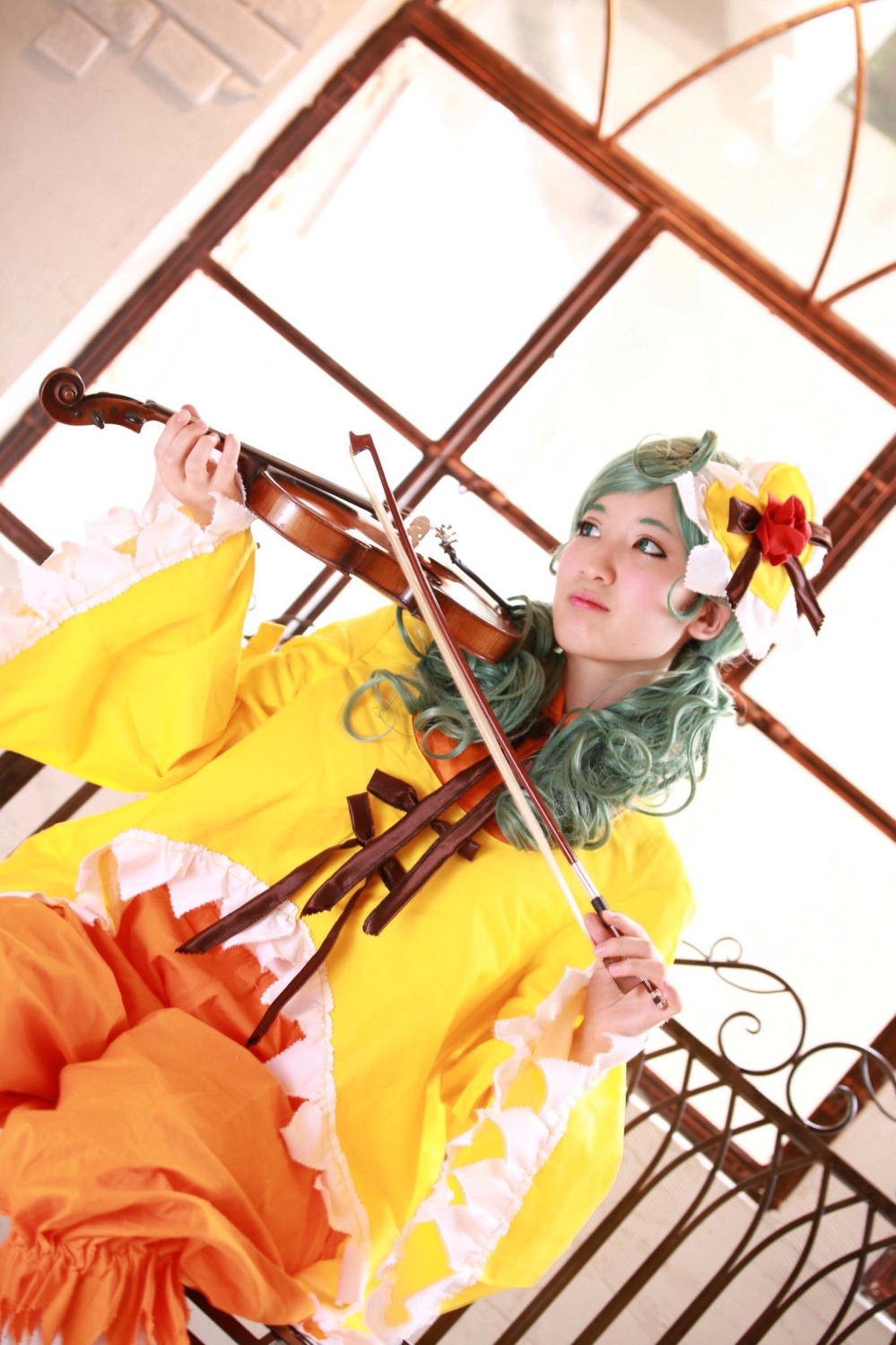 1girl bow_(instrument) flower green_hair hair_flower hair_ornament indoors instrument kanaria long_hair long_sleeves music playing_instrument solo violin window yellow_dress
