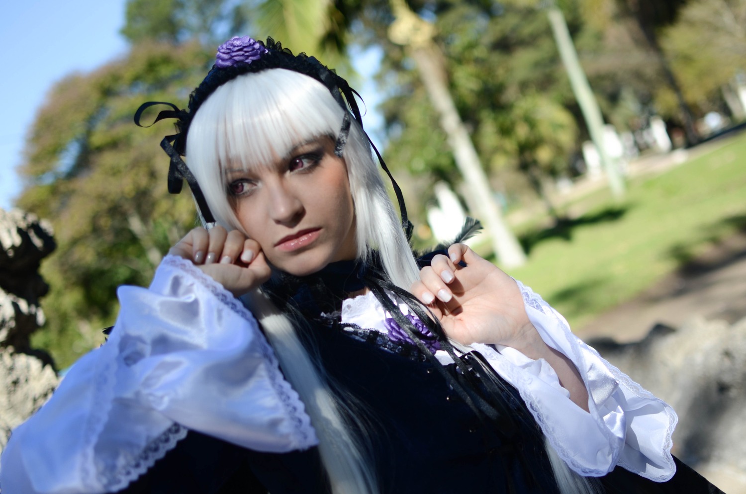 1girl 3d blurry blurry_background blurry_foreground closed_mouth depth_of_field flower gothic_lolita hairband lips long_sleeves looking_at_viewer nail_polish solo suigintou