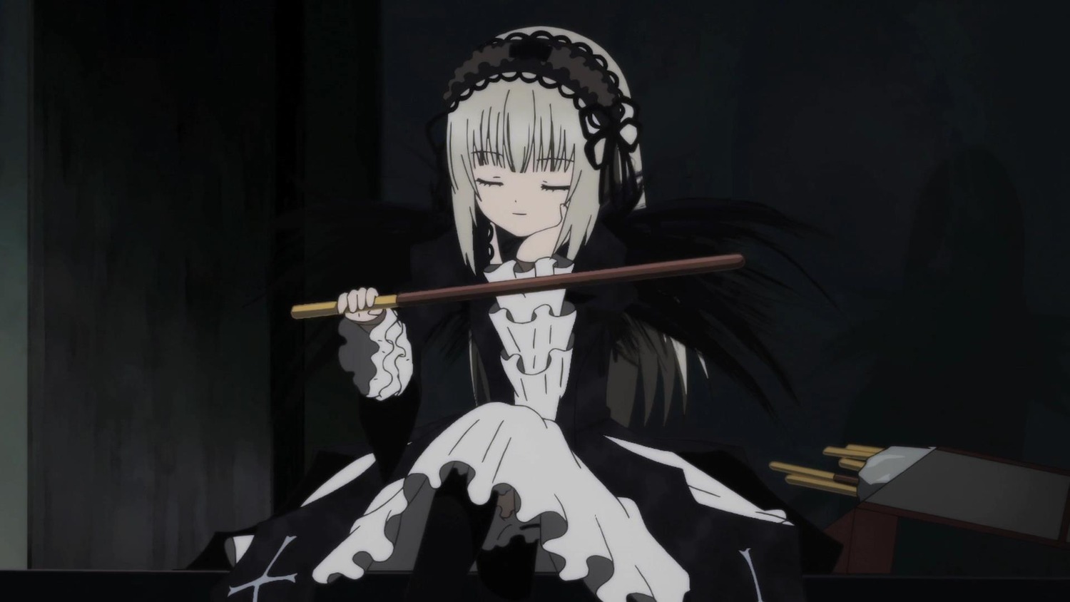 1girl bangs black_background black_dress black_hairband closed_eyes closed_mouth dress frills hairband holding image knees_up long_sleeves silver_hair sitting solo suigintou