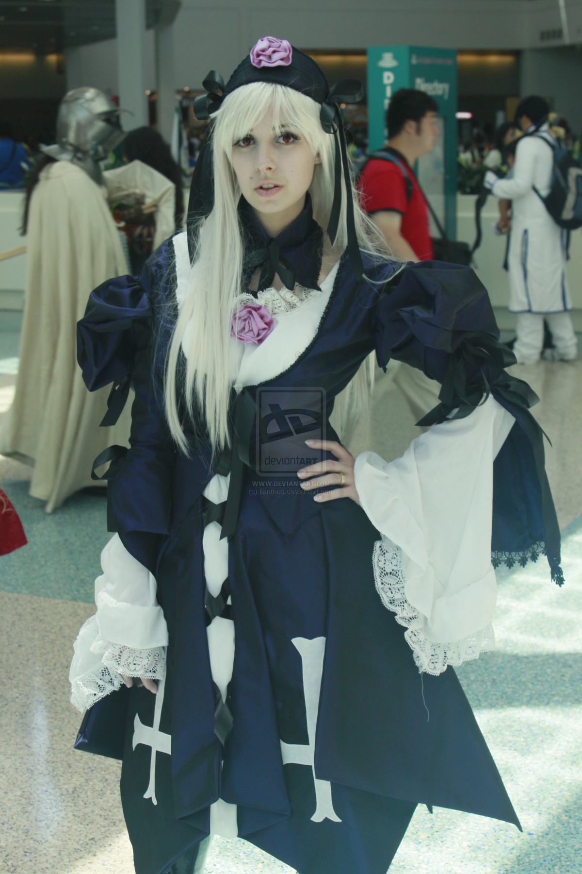 1girl 3d blonde_hair blurry blurry_background depth_of_field dress hat indoors long_hair long_sleeves looking_at_viewer photo solo solo_focus standing suigintou