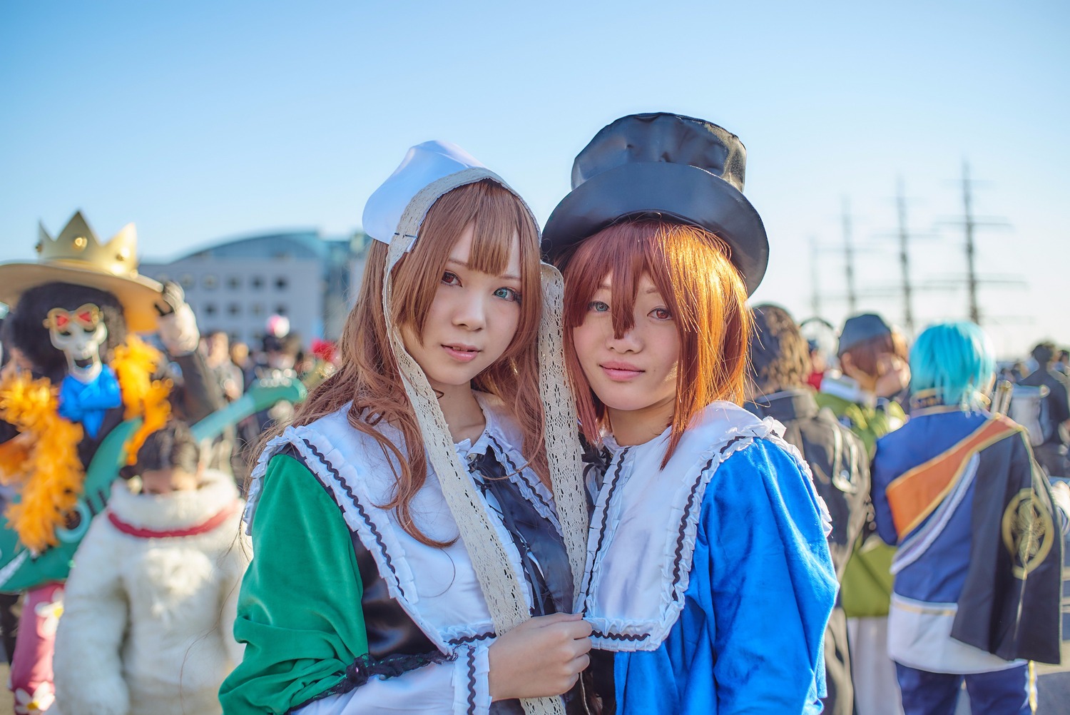 2girls blonde_hair blue_eyes blurry blurry_background day depth_of_field hat lips long_hair multiple_boys multiple_cosplay multiple_girls photo realistic smile tagme