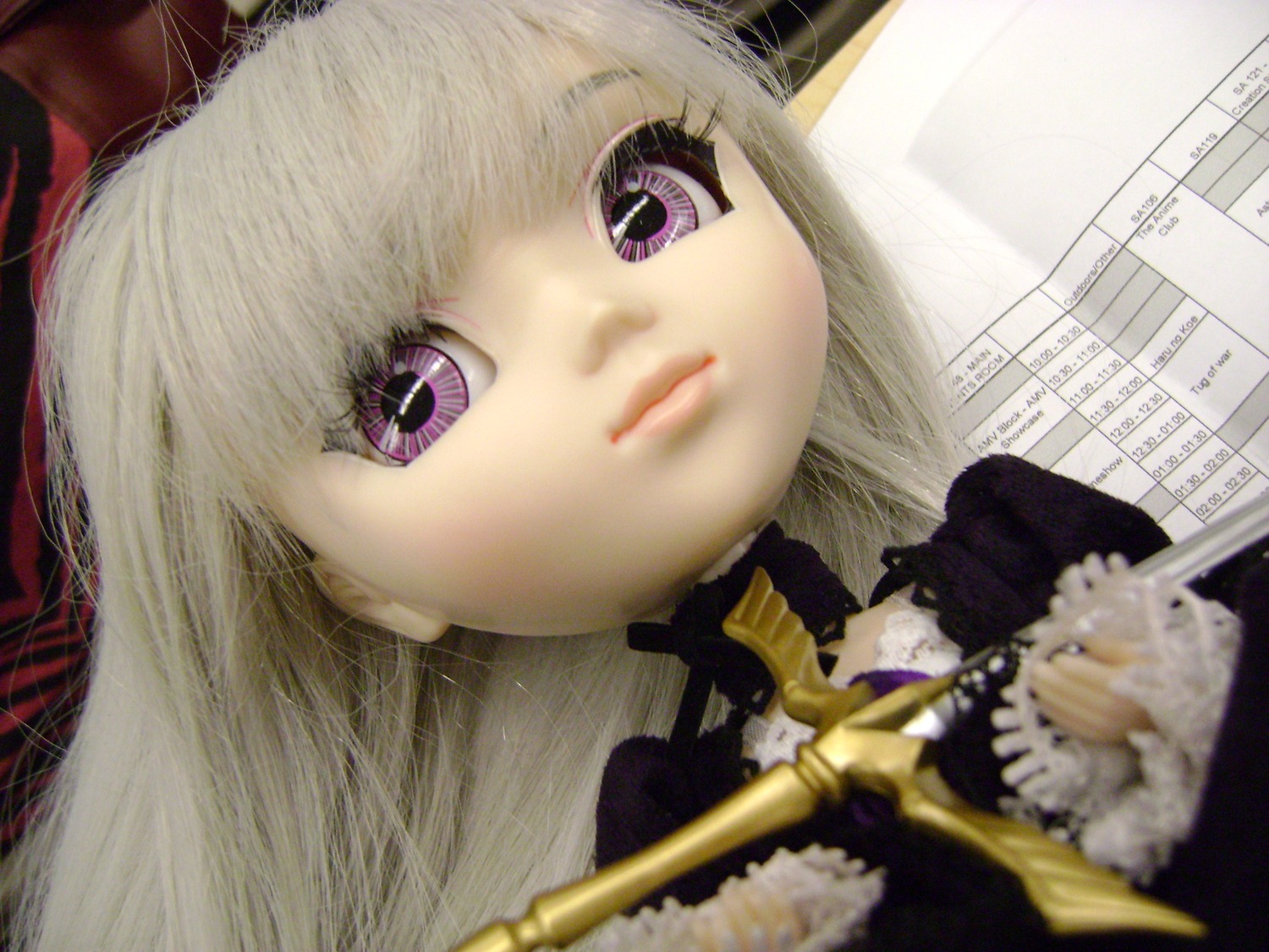 1girl bangs blonde_hair close-up closed_mouth doll hat lips long_hair looking_at_viewer purple_eyes ribbon solo suigintou