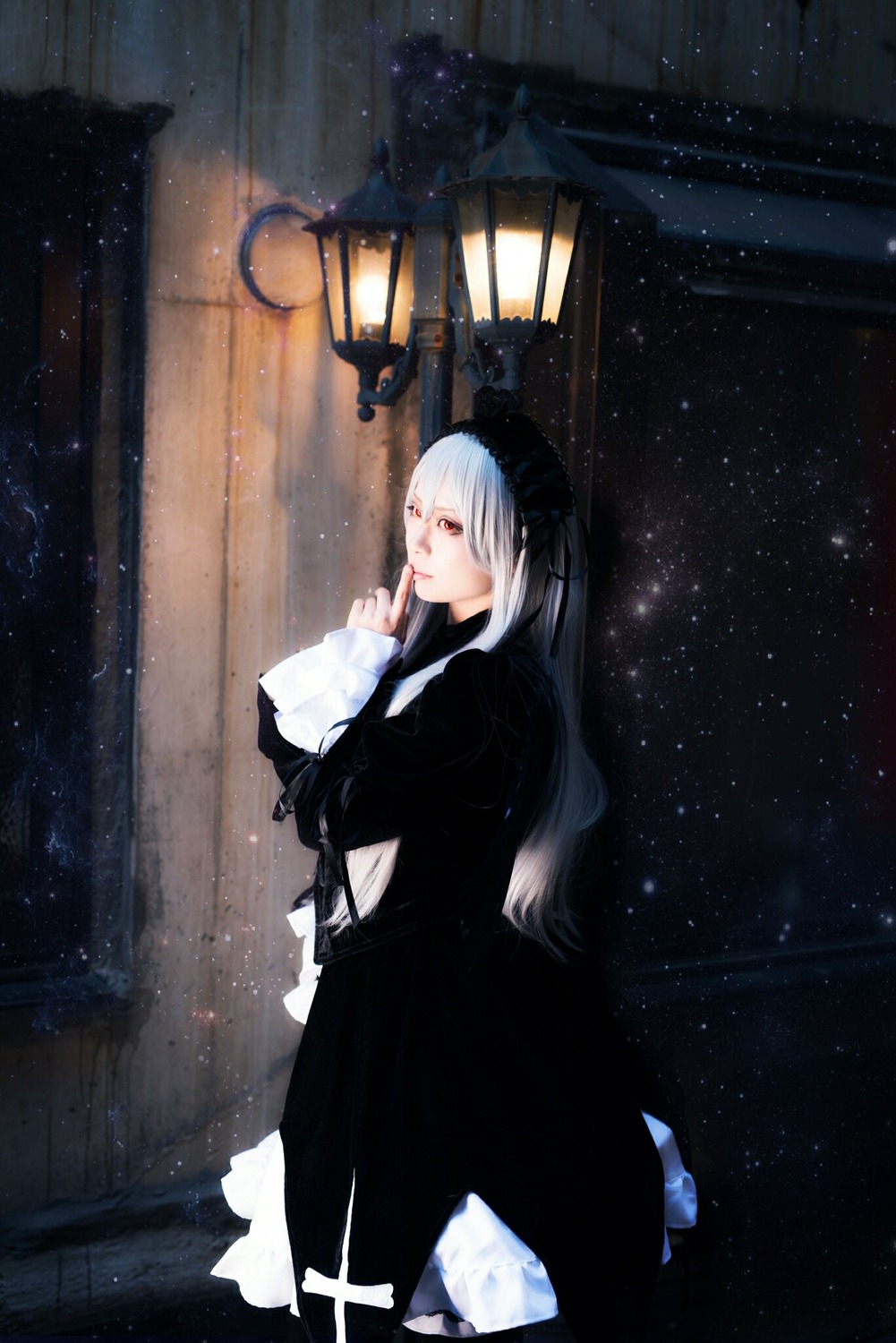 1girl black_dress dress gothic_lolita hairband lolita_fashion long_hair looking_at_viewer night night_sky red_eyes sky solo standing star_(sky) starry_sky suigintou