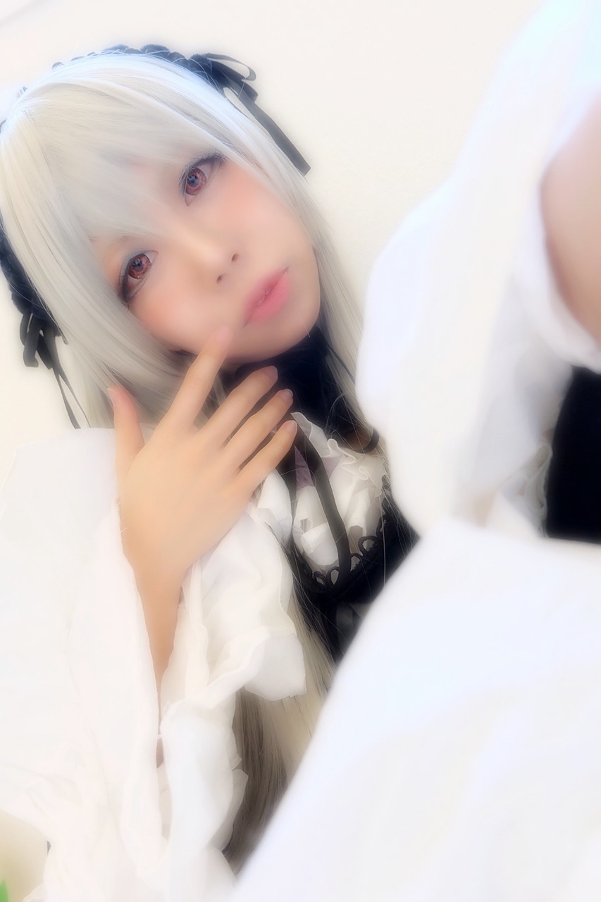 1girl 3d bangs black_ribbon blurry blurry_foreground closed_mouth depth_of_field hair_ribbon lips looking_at_viewer photo ribbon solo suigintou