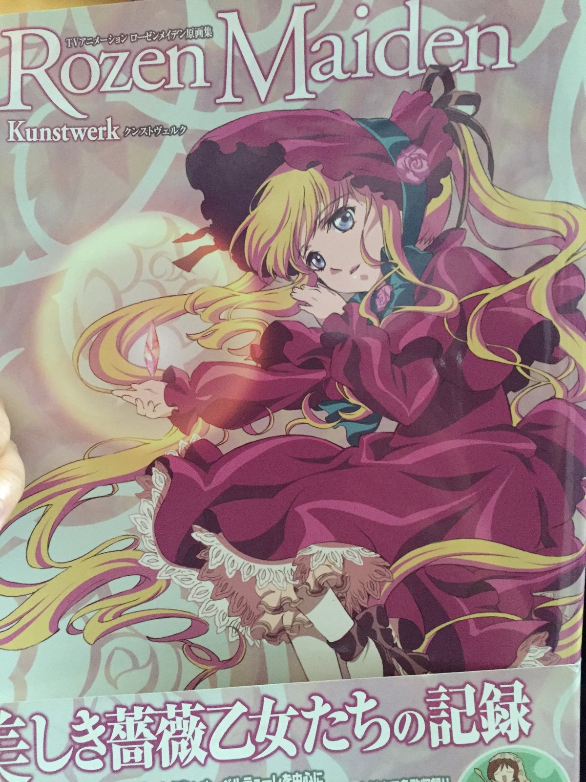 1girl blonde_hair blue_eyes bonnet bow bowtie copyright_name cover dress flower frills image logo long_hair long_sleeves looking_at_viewer pink_flower pink_rose red_dress rose shinku solo twintails very_long_hair