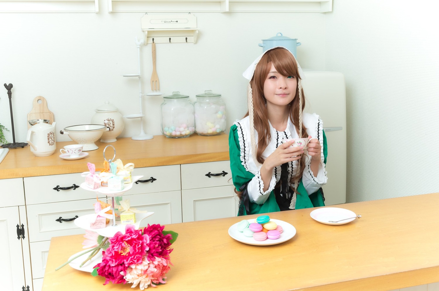 1girl brown_hair dress flower food green_dress indoors kitchen knife long_hair plate solo suiseiseki table