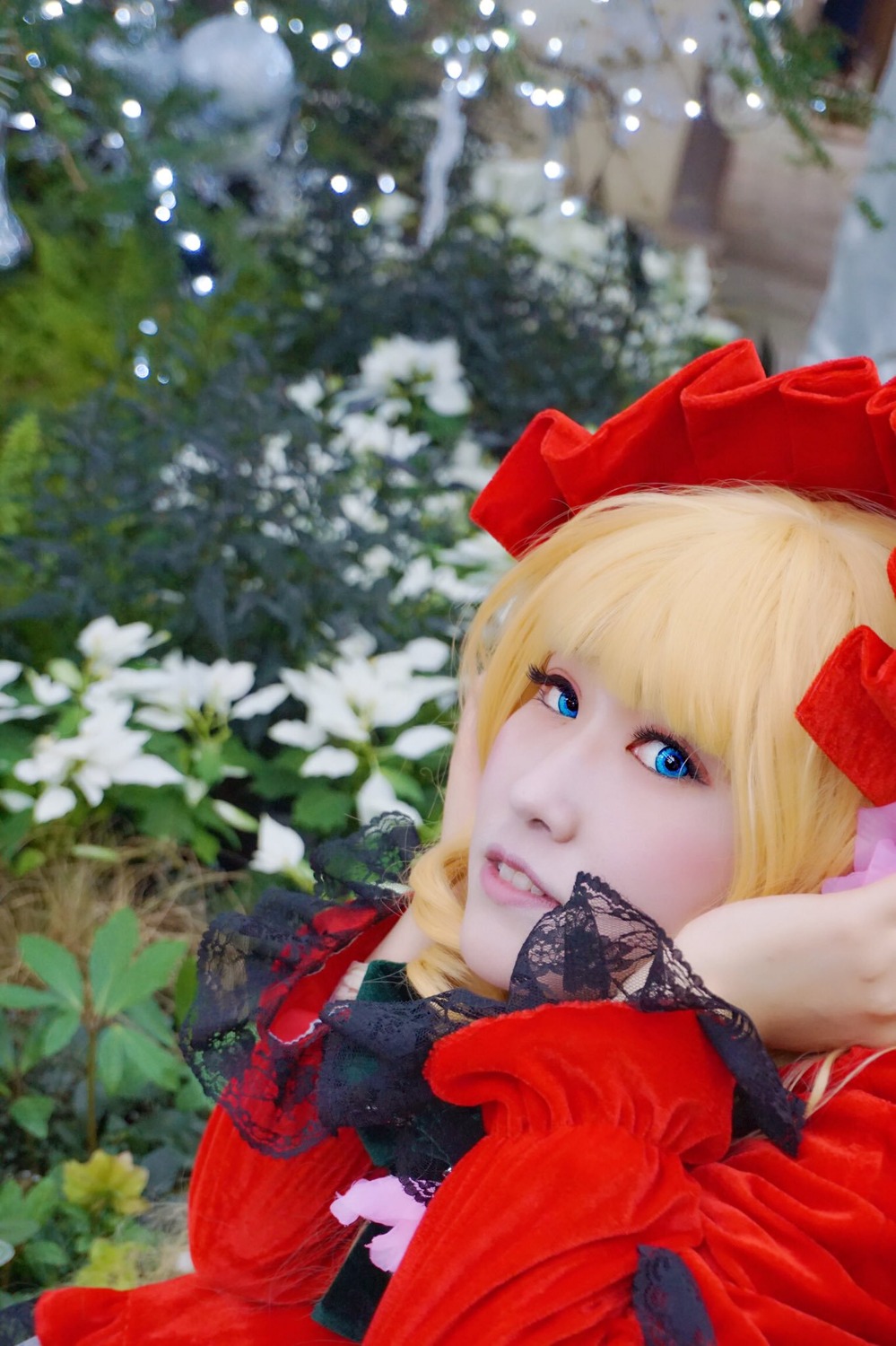 1girl bangs blonde_hair blue_eyes blurry bow bug butterfly depth_of_field flower hair_bow insect lips red_bow red_dress shinku solo