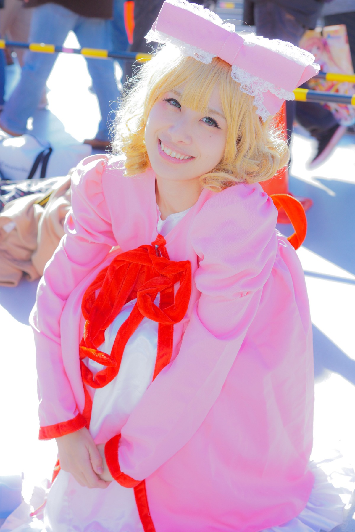 1girl blonde_hair blue_eyes blurry depth_of_field dress flower frills grin hat hinaichigo lips ribbon smile solo teeth umbrella