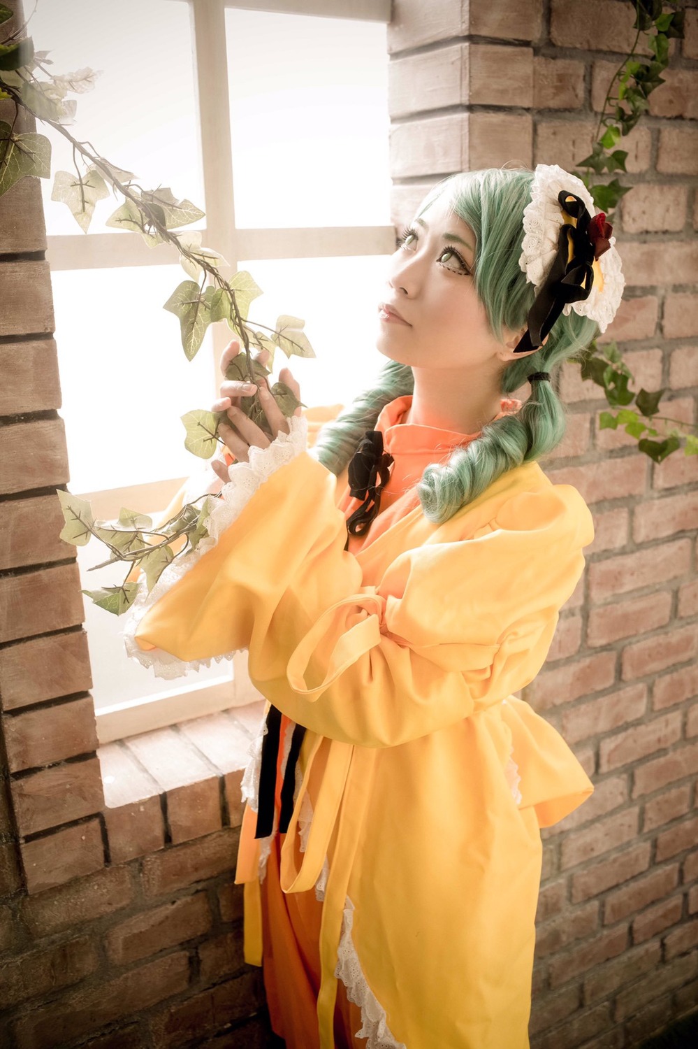 1girl brick_wall dress drill_hair flower frills green_hair kanaria orange_dress plant solo standing window yellow_dress