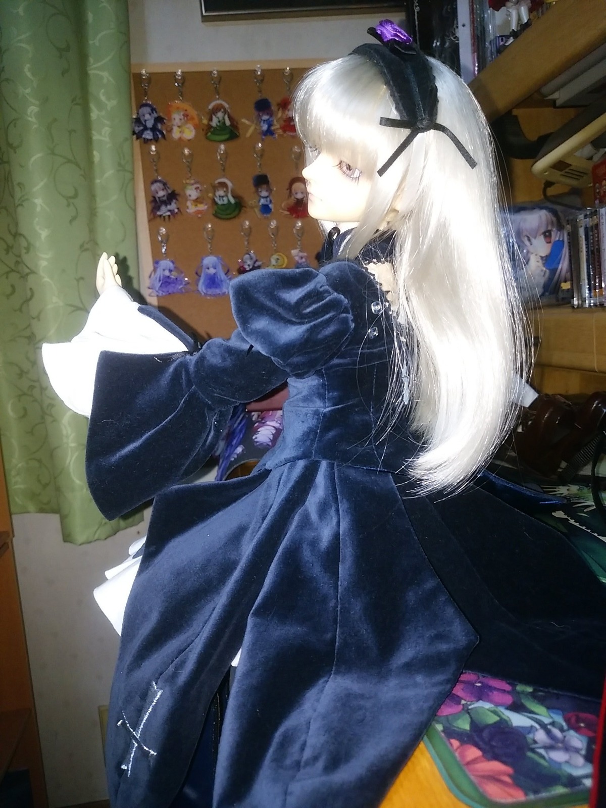 1girl black_dress doll dress flower long_hair long_sleeves photo ribbon solo suigintou white_hair