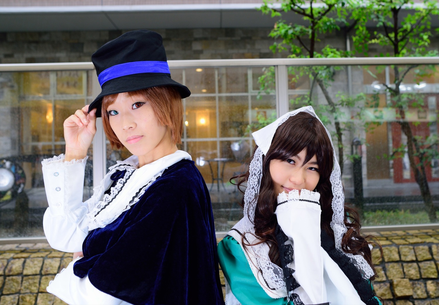 2girls blue_eyes brick_wall brown_hair building dress fence frills hat long_hair long_sleeves looking_at_viewer multiple_cosplay multiple_girls outdoors smile tagme top_hat upper_body window