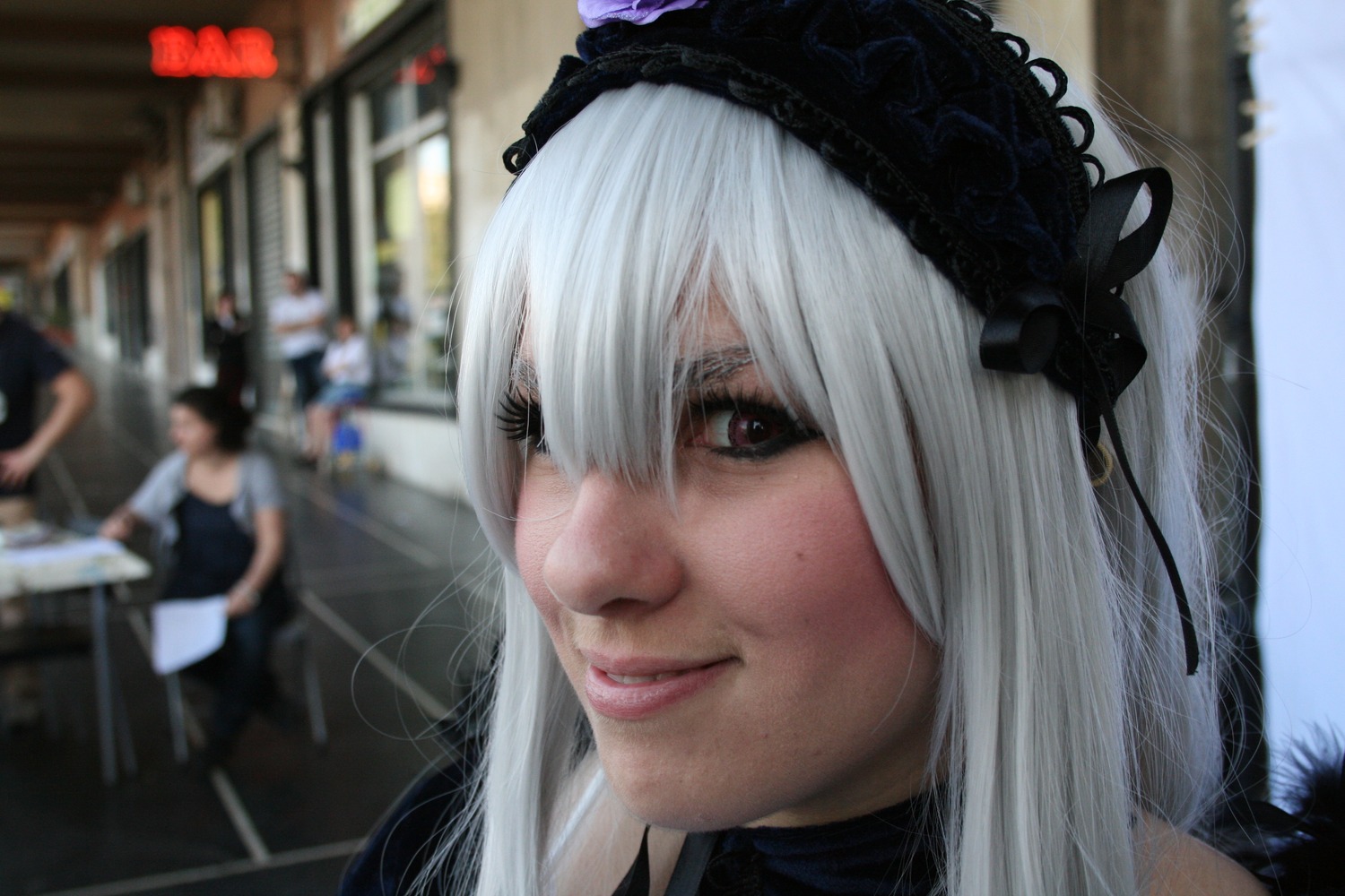 3d blurry blurry_background blurry_foreground closed_mouth depth_of_field eyepatch figure hair_over_one_eye hairband lips multiple_girls photo silver_hair solo suigintou