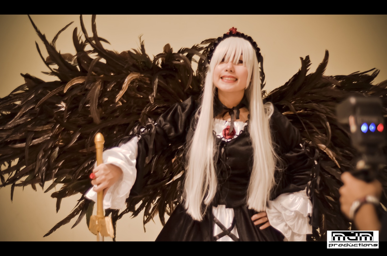 1girl black_dress black_wings blurry depth_of_field doll_joints dress feathers hairband letterboxed long_hair long_sleeves open_mouth rose silver_hair solo suigintou white_hair wings