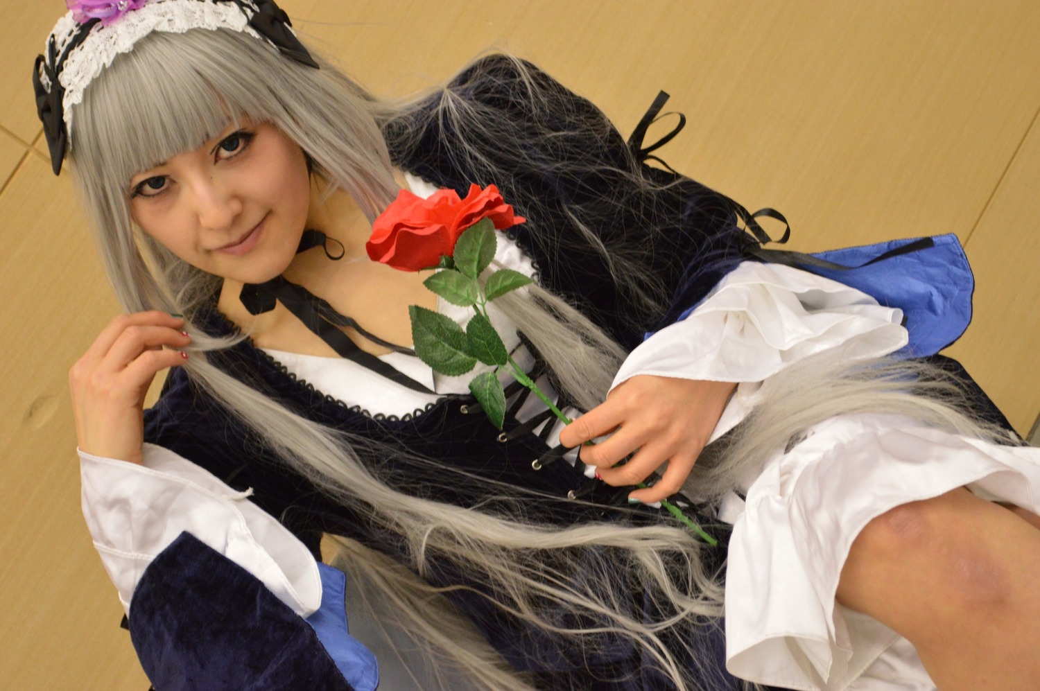 1girl bangs blunt_bangs closed_mouth flower lace lips lolita_fashion long_hair long_sleeves looking_at_viewer nail_polish smile solo suigintou