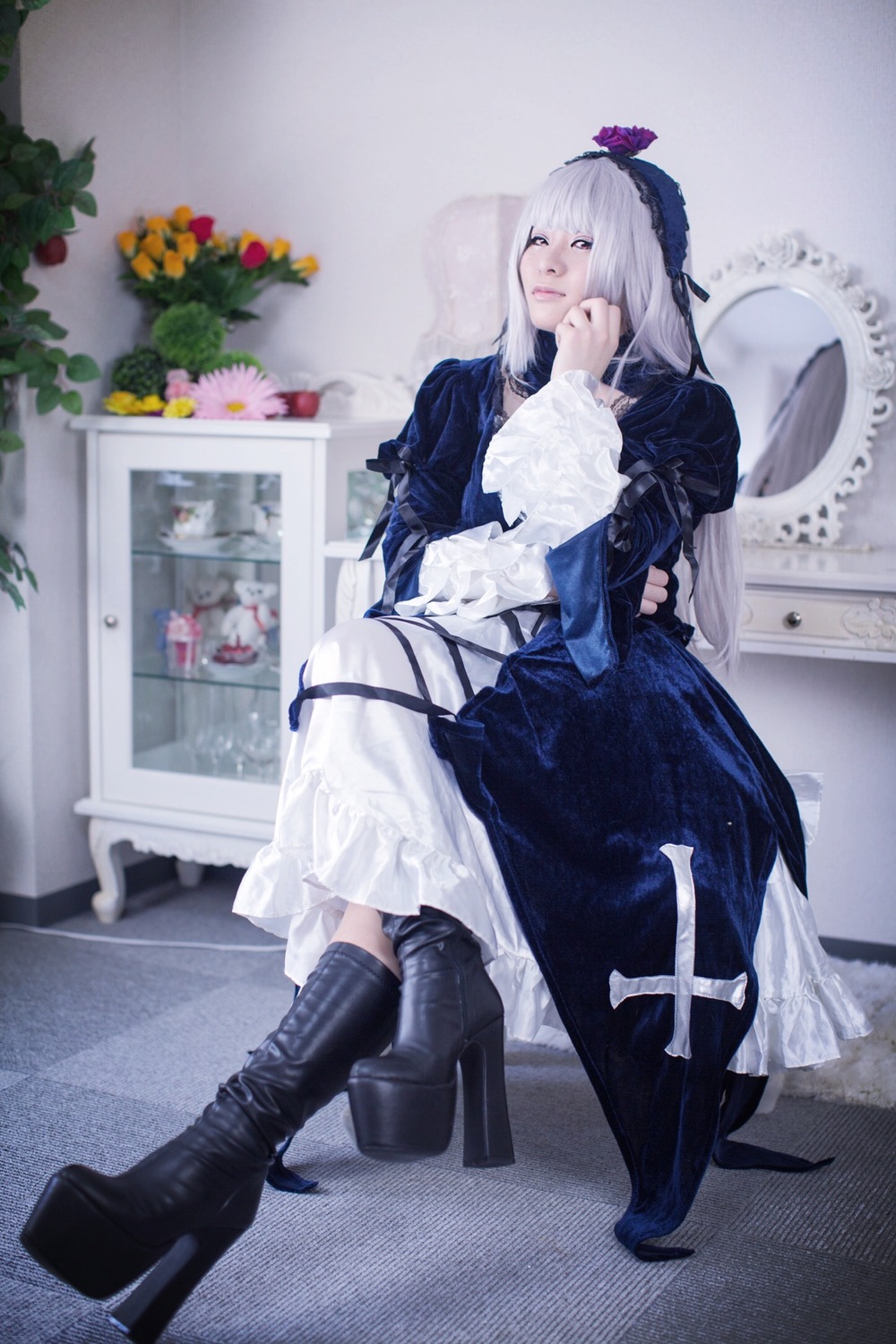 1girl black_footwear boots closed_eyes dress flower frills hairband high_heel_boots high_heels long_sleeves photo profile solo standing suigintou