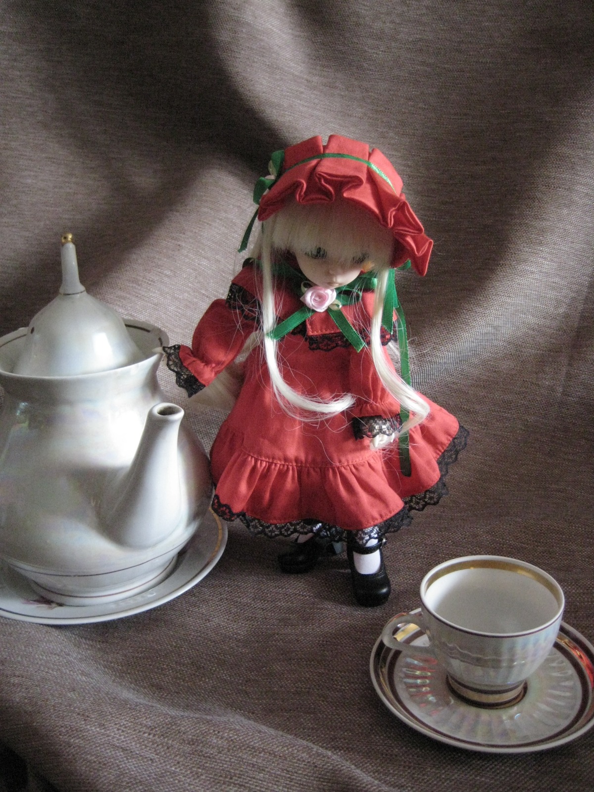 1girl bonnet bow cup doll dress flower long_hair red_dress shinku solo teacup