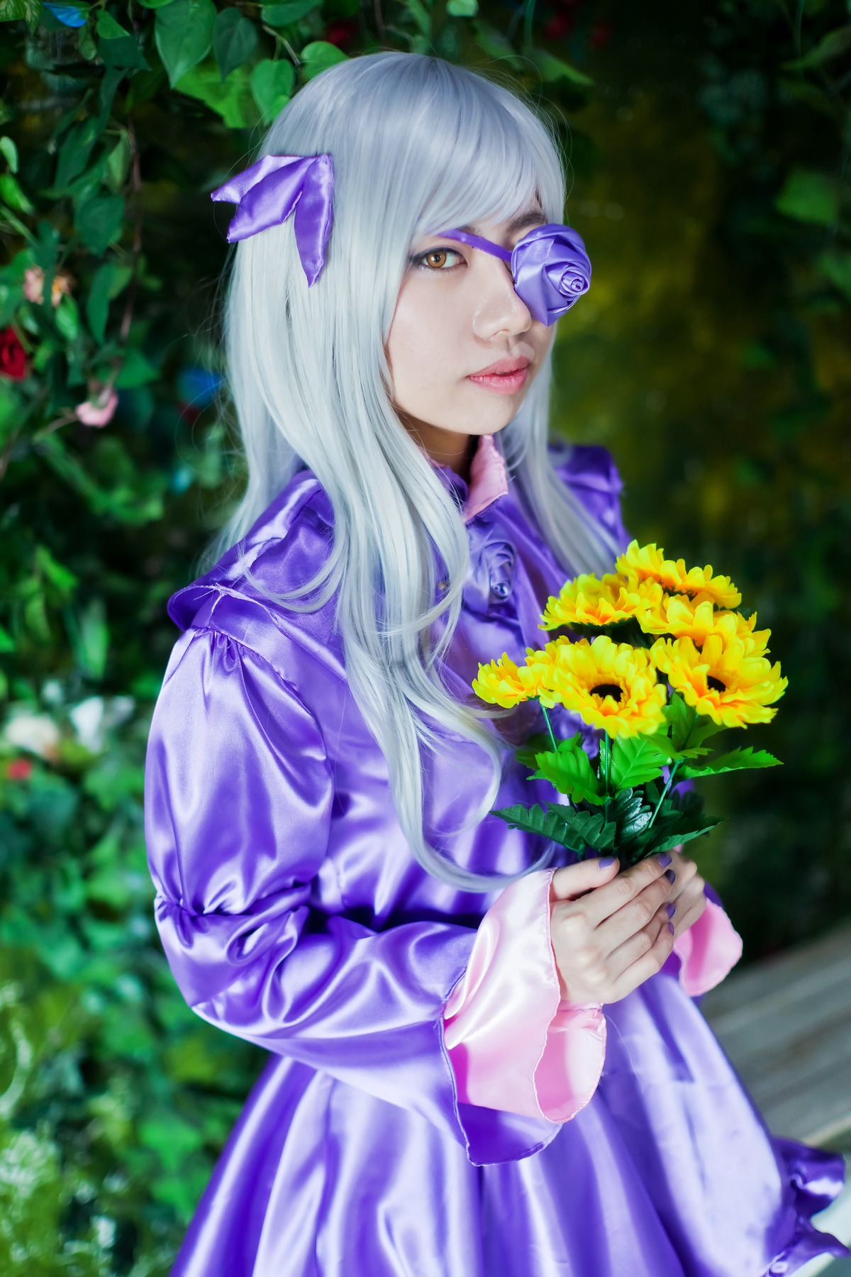 1girl barasuishou blurry blurry_background bug butterfly depth_of_field dress eyepatch flower holding insect lips long_hair long_sleeves makeup nail_polish nose outdoors solo