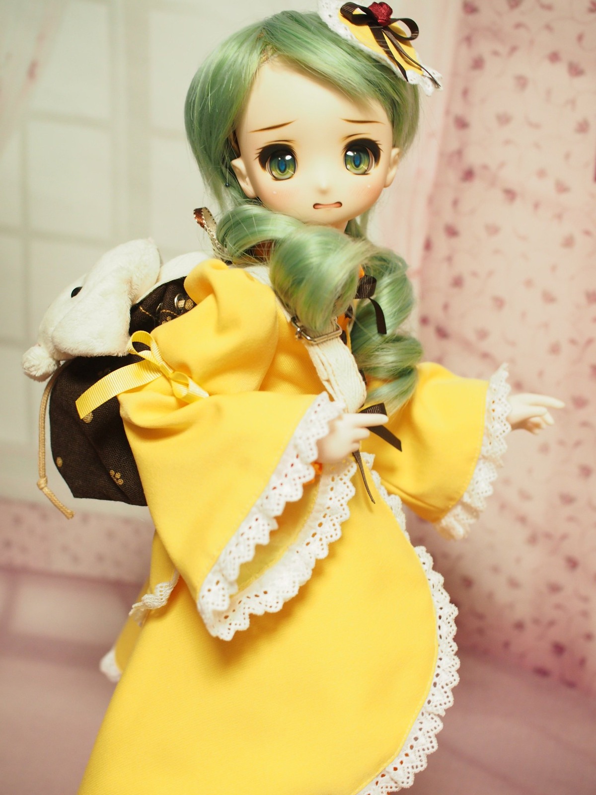 1girl blurry depth_of_field doll drill_hair frills green_eyes green_hair hair_ornament kanaria long_sleeves looking_at_viewer solo wide_sleeves yellow_dress