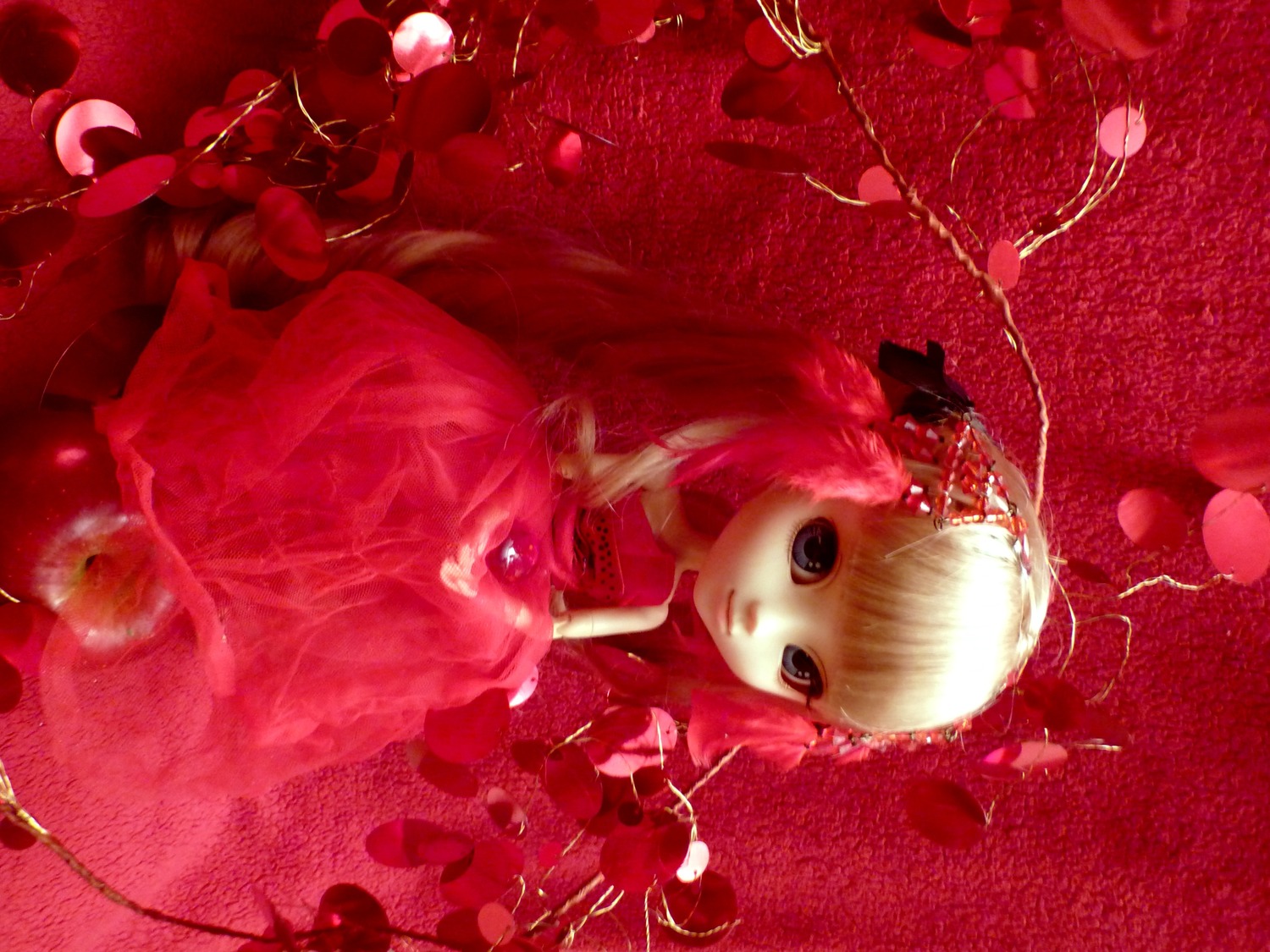 1girl blonde_hair doll dress flower long_hair looking_at_viewer red_background red_dress red_flower red_theme rose shinku sitting solo