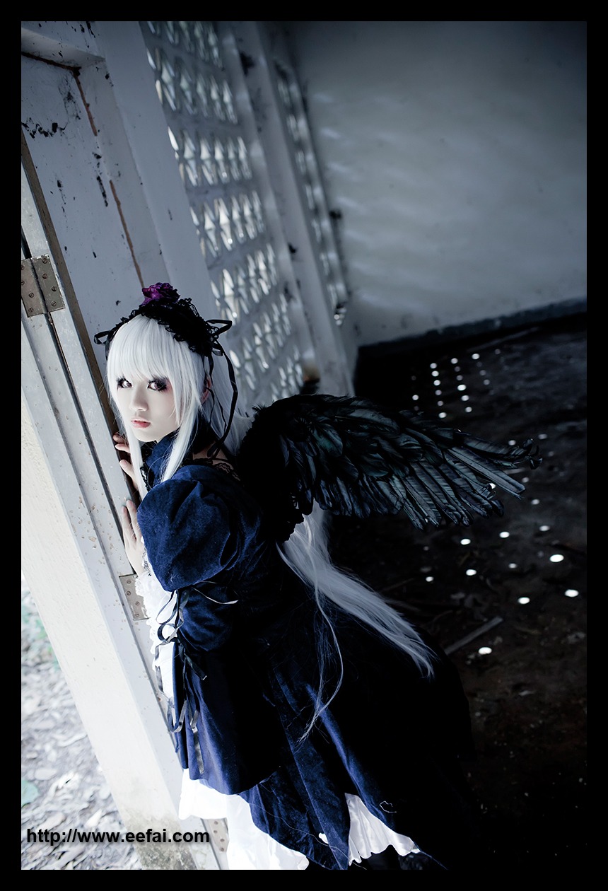 1girl bangs black_border black_dress black_wings border building dress feathered_wings feathers letterboxed lips long_hair long_sleeves looking_at_viewer outdoors pillarboxed snow snowing solo suigintou white_hair wings