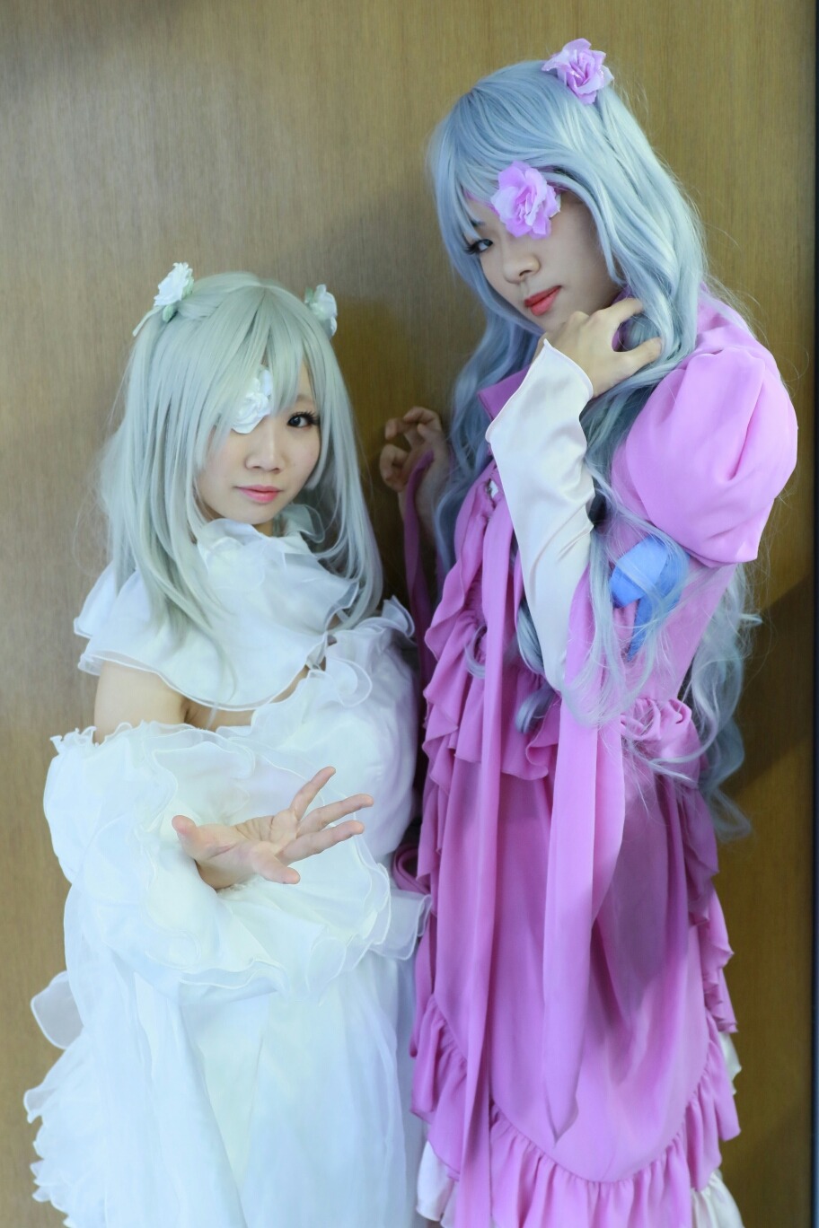 2girls dress eyepatch flower hair_flower hair_ornament hair_over_one_eye lips long_hair multiple_cosplay multiple_girls realistic tagme