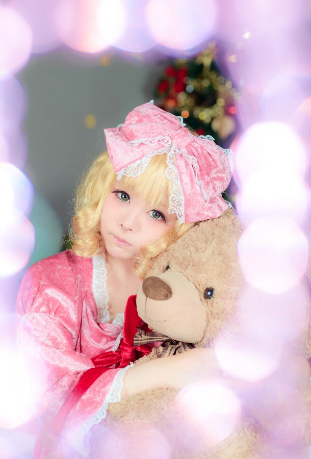 1girl animal bangs blonde_hair blurry bow depth_of_field hair_bow hinaichigo lips looking_at_viewer pink_bow smile solo striped stuffed_animal teddy_bear upper_body