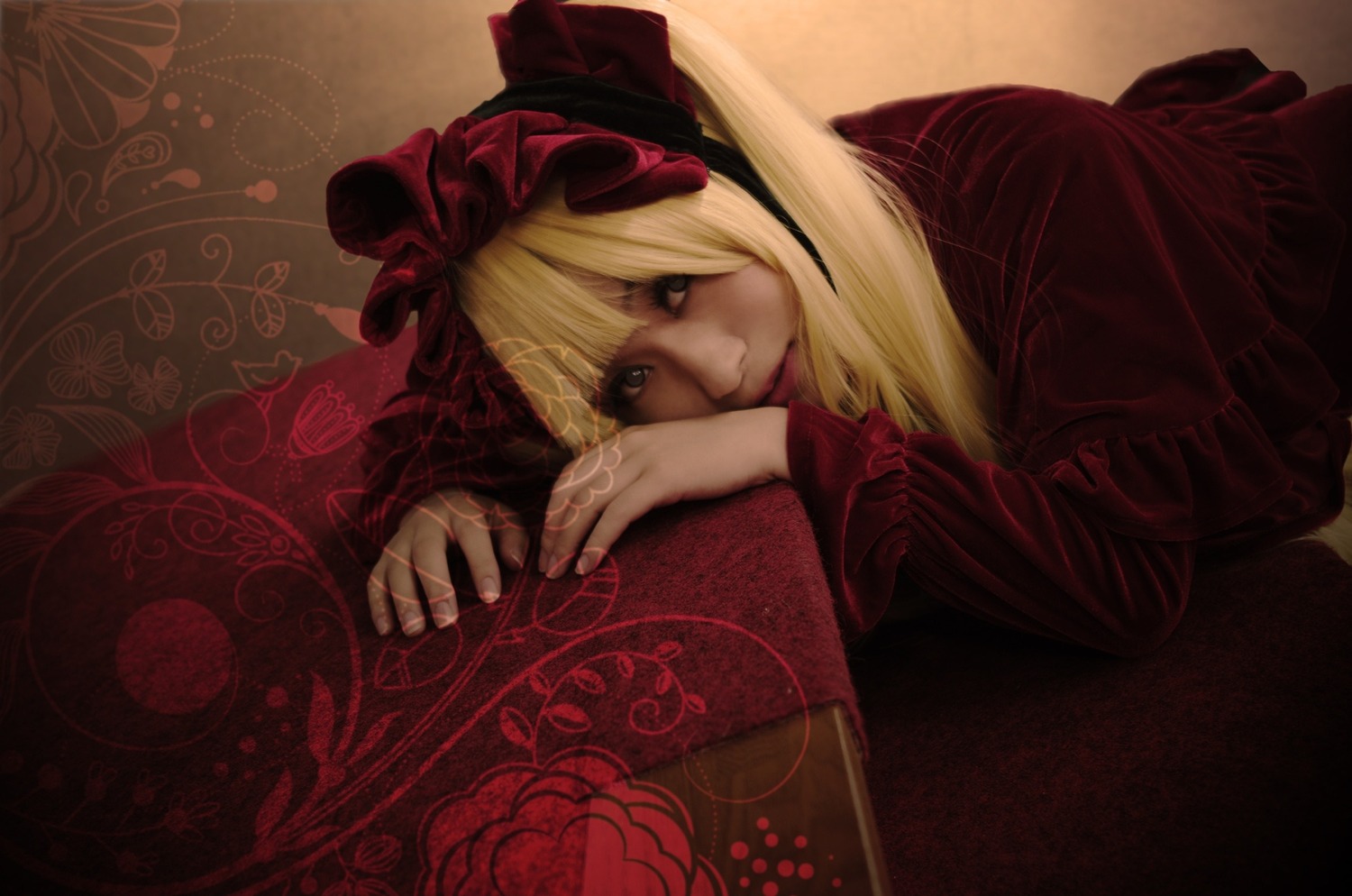 1girl blonde_hair bow dress flower hair_bow lips long_sleeves looking_at_viewer lying realistic ribbon shinku solo