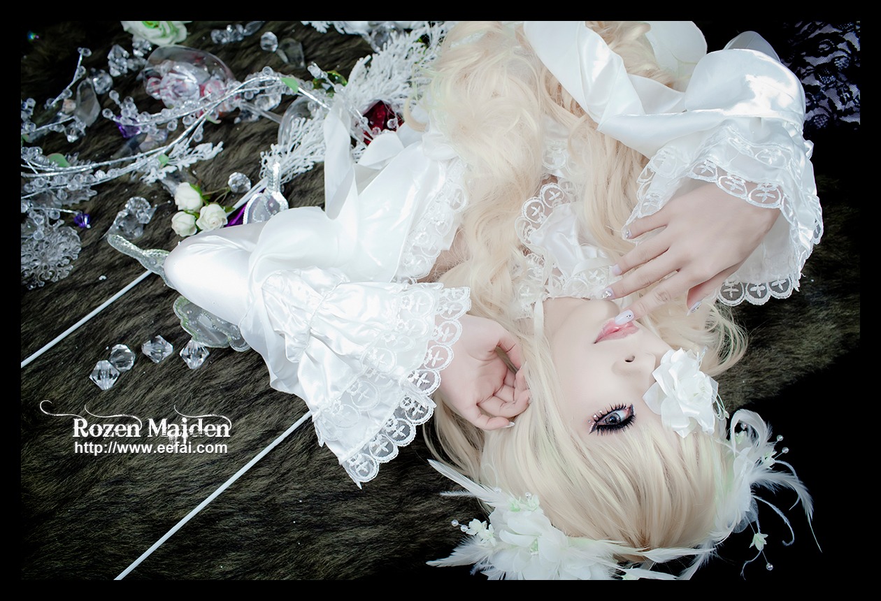 1girl black_background blonde_hair blue_eyes flower kirakishou lace letterboxed lips lolita_fashion long_hair long_sleeves makeup solo upper_body