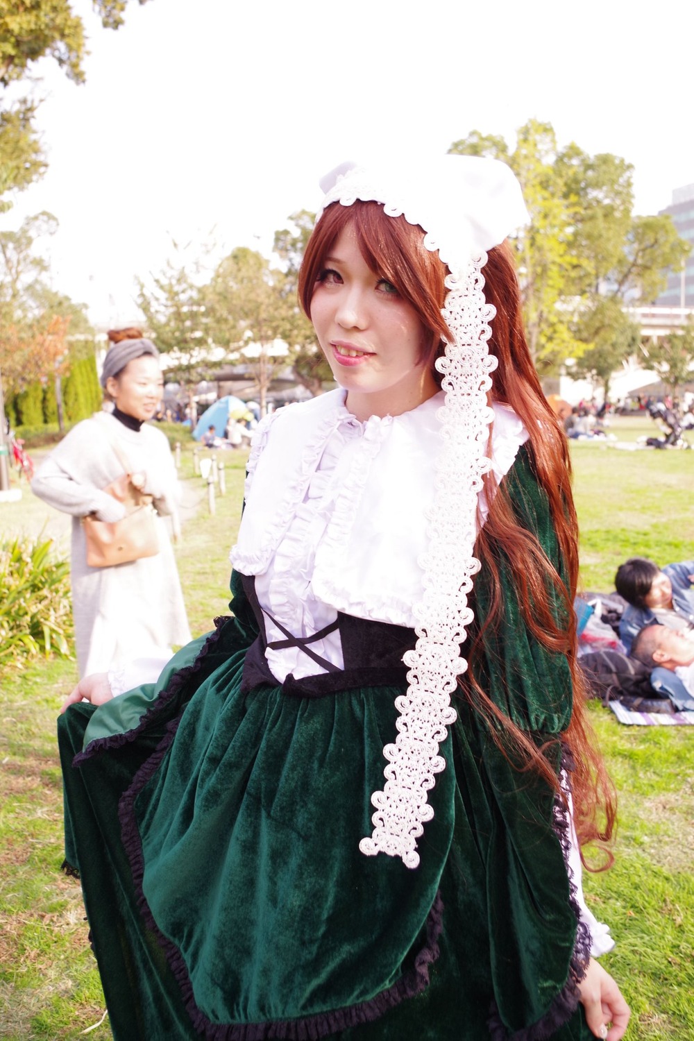 1girl brown_hair day dress grass lips long_hair looking_at_viewer outdoors solo standing suiseiseki tree