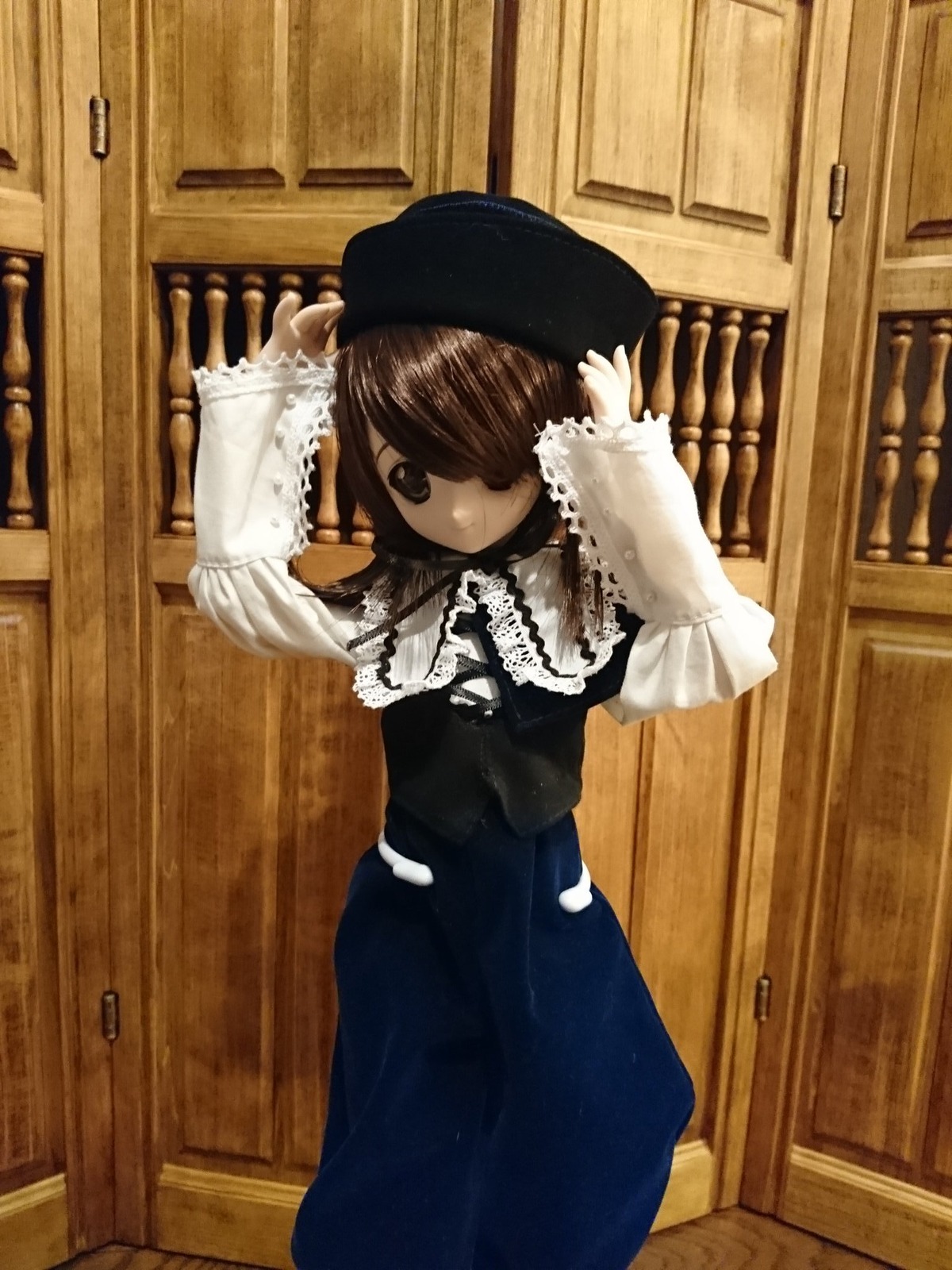 1girl black_dress black_eyes brown_hair capelet doll dress frills hair_over_one_eye hat indoors long_sleeves looking_at_viewer solo souseiseki standing