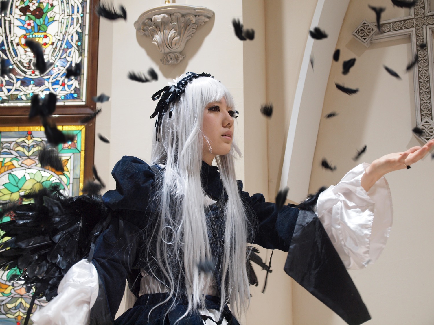 1girl bird crow dress feathers indoors long_hair long_sleeves silver_hair solo suigintou wings