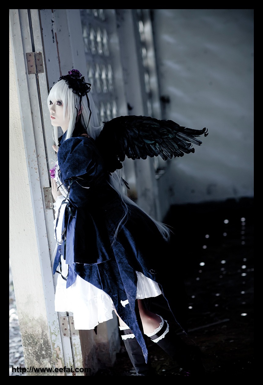 1girl black_border black_wings blurry depth_of_field dress feathers letterboxed long_hair pillarboxed profile solo standing suigintou white_hair wings